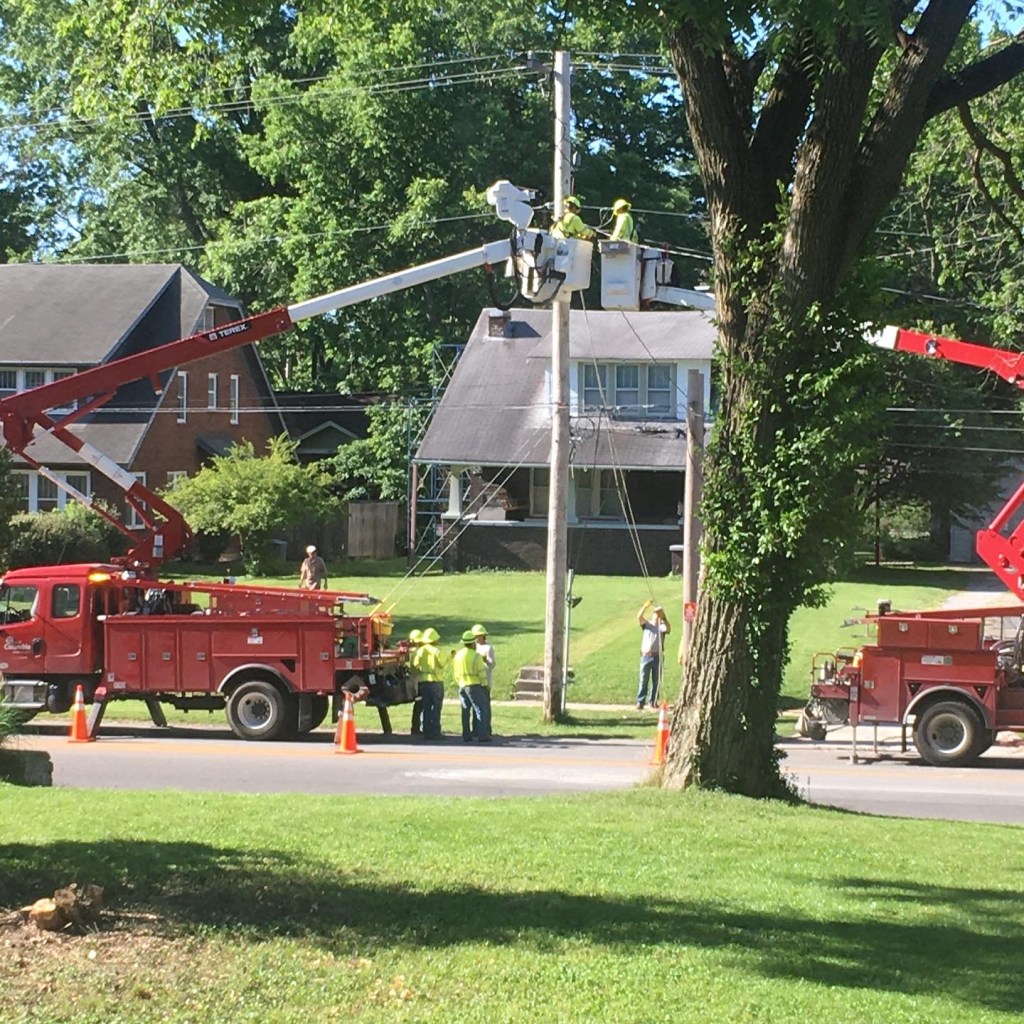 Utility crew working on pole